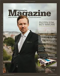 Bilden visar en man på en balkong, inramad av en grön ram. Det är ett omslag till tidningen Enterprise Magazine.