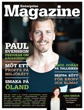 En mörk bakgrund och en man i svart T-shirt som ler in i kameran. Längre ner står en kvinna som ler in i kameran med huvudet lätt lutat. Det här är omslaget till tidningen Enterprise Magazine.