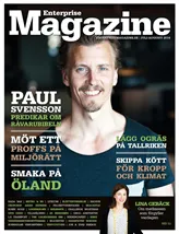 En mörk bakgrund och en man i svart T-shirt som ler in i kameran. Längre ner står en kvinna som ler in i kameran med huvudet lätt lutat. Det här är omslaget till tidningen Enterprise Magazine.