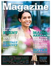 En före detta idrottskvinna sitter bakom suddiga blommor och ler in i kameran. Det här är omslaget till tidningen Enterprise Magazine.